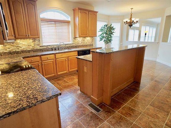 Granite countertops, ceramic tile flooring, updated tile backsplash, new wine fridge, convection oven, refrigerator.