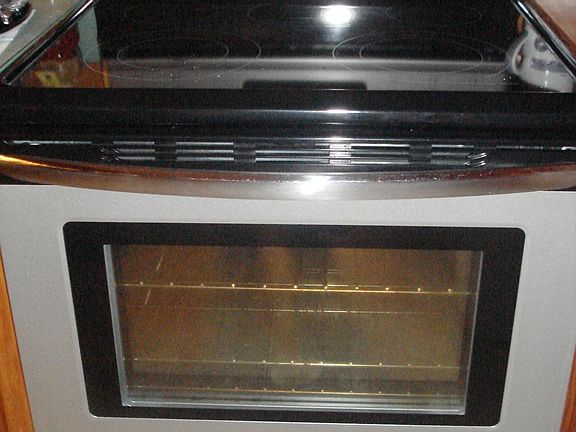 All major appliances stay, including this new stainless Frigidaire stove