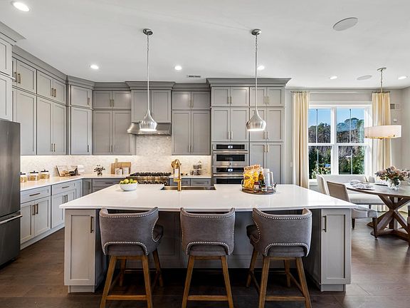 Spacious kitchen and adjacent breakfast area with access to rear patio