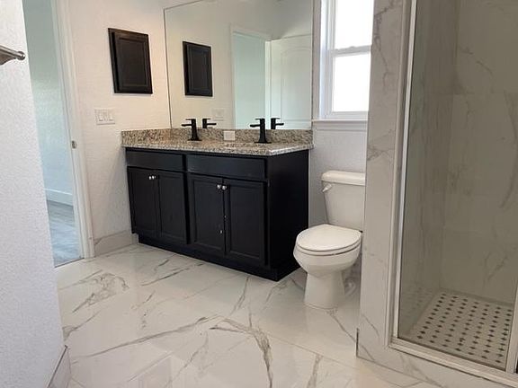 Spacious bathrooms with modern fixtures, combined style and functionality