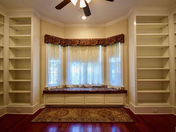 library with storage under window seat