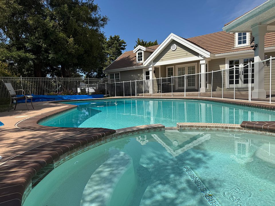 Pool Front Cottage - A portion to the left of the home. French Doors, Front Patio, Quiet overlooking mature trees.