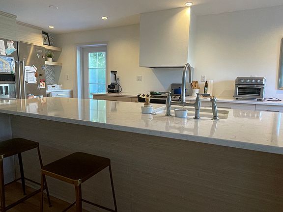 Modern kitchen open to dining room