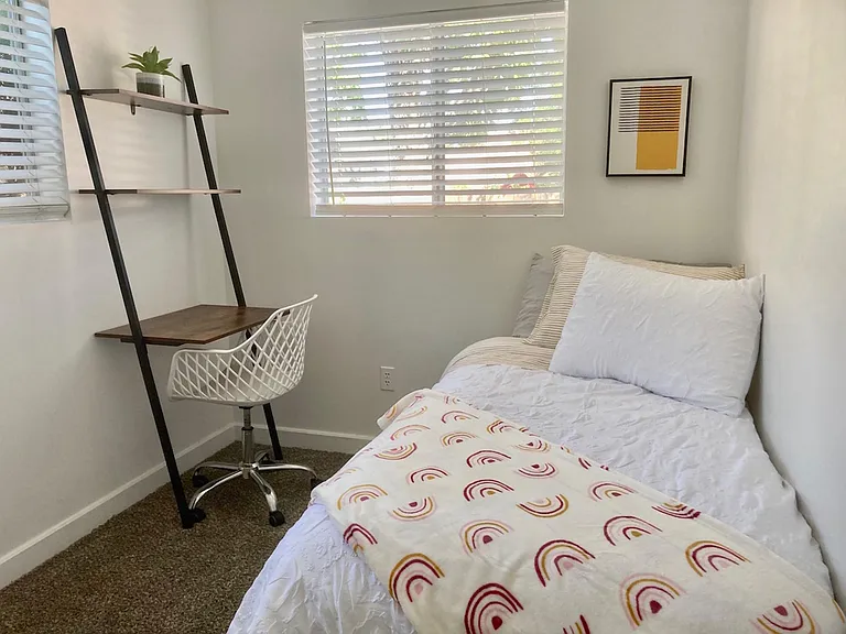 Guest room with private workspace and twin trundle beds