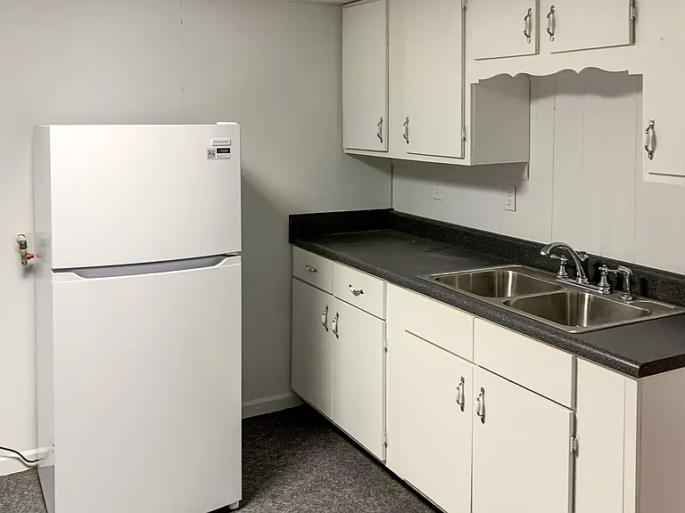 Separate kitchenette with fridge on terrace level