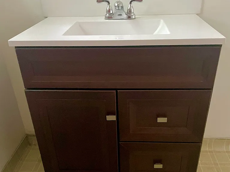 Brand new bathroom sink, faucet and vanity cabinet