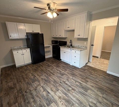 Kitchen with new refrigerator, new stove and microwave