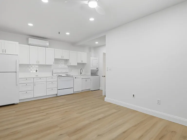 View of Kitchen + Private Laundry