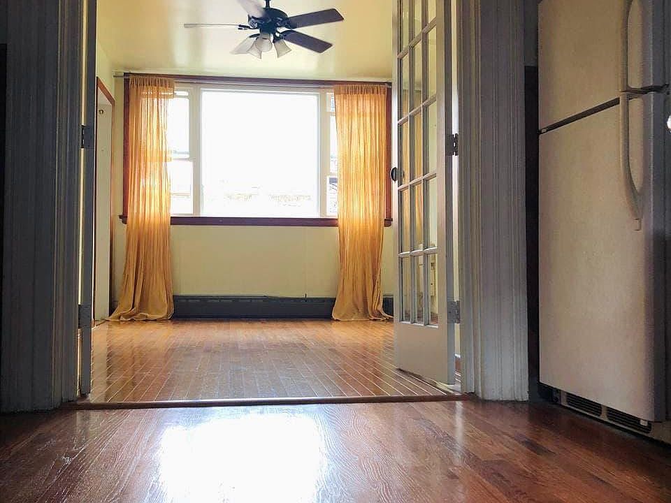 Kitchen and living room separated by french doors