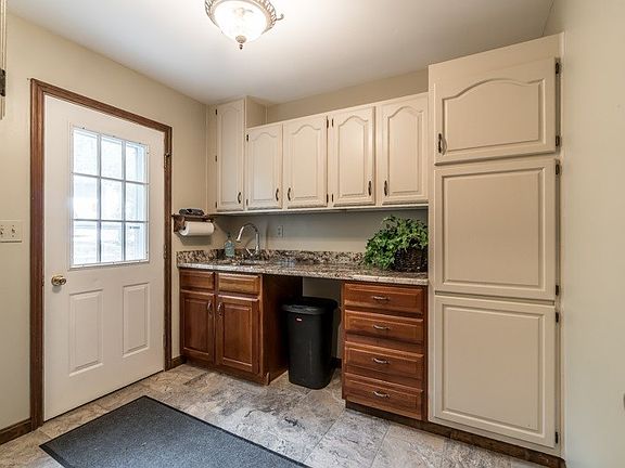 Mud Room, but also has laundry hookups for a first floor laundry.
