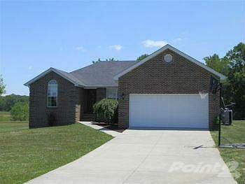 Concrete drive to pretty brick ranch
