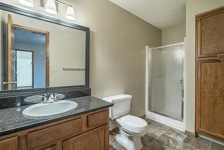 This Seward bathroom features a walk-in shower, generous counter space, and built-in storage to help keep your morning routine running smoothly.