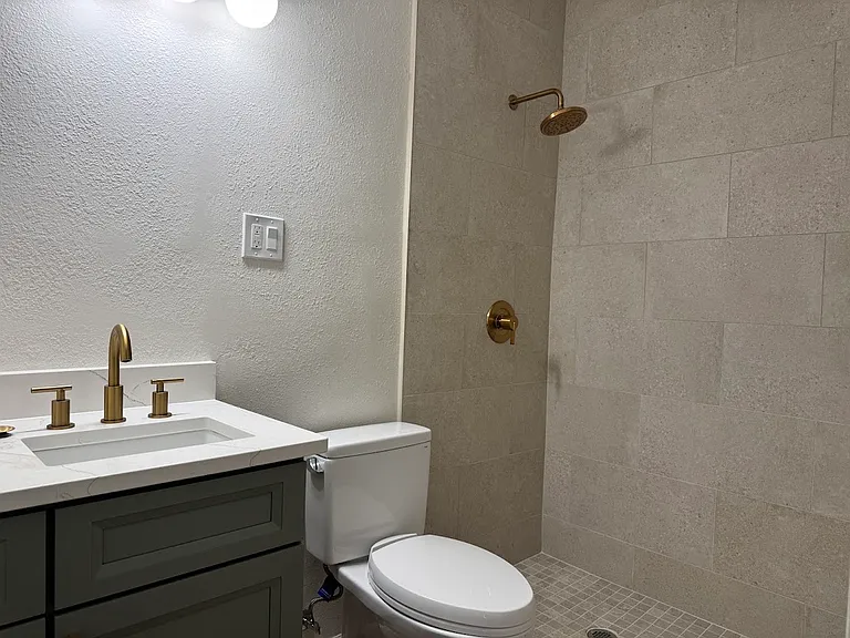Bathroom with tiled shower