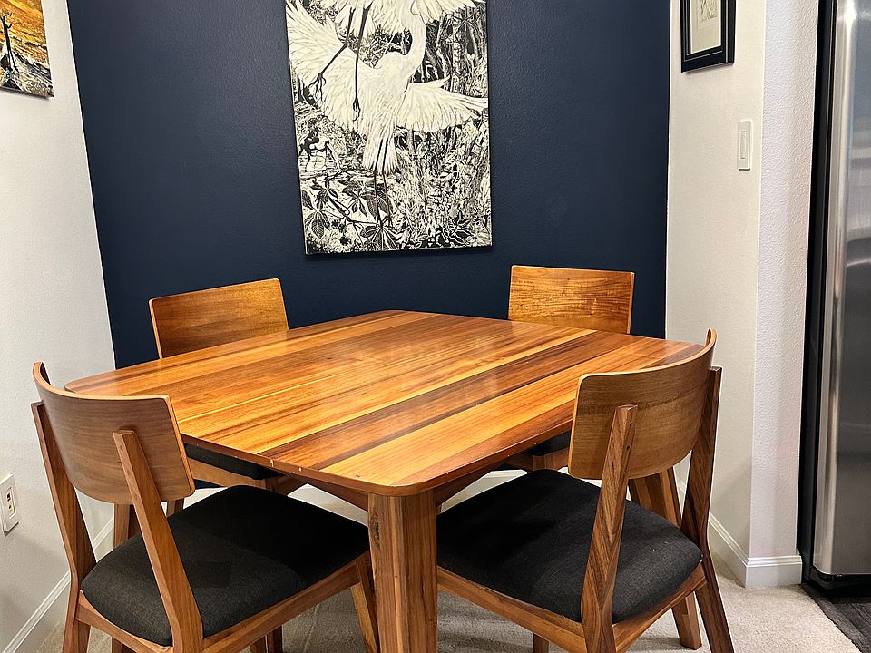 Dining area with original artwork on wall