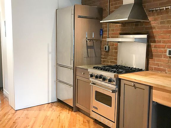 Hide away pantry shelving pulls out of kitchen wall.