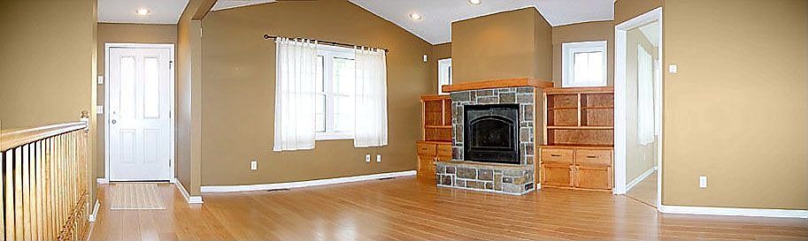 Great Room with Hardwood Floors, Custom Surround and Gas Fireplace