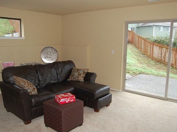 A great home theater room, this family room has access to the large fenced back yard and views of th
