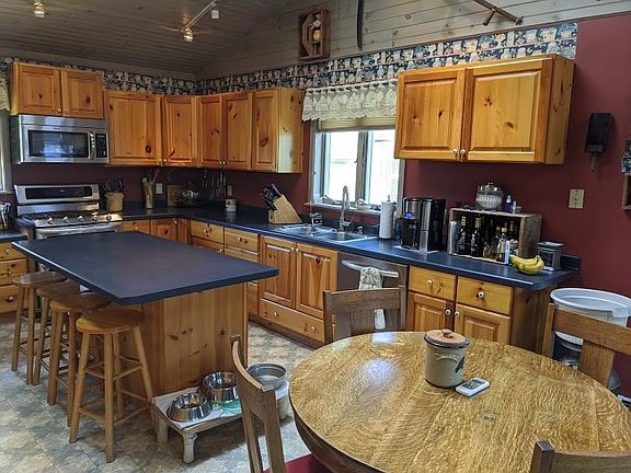 Kitchen with snack bar and appliances included