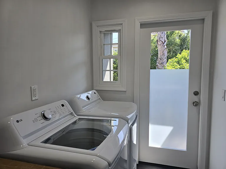 Laundry room with new washer & dryer