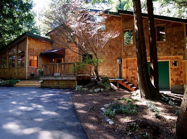 Beautiful contemporary cedar-shingled home on private acre