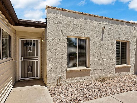 Enclosed patio area to the right of the carport