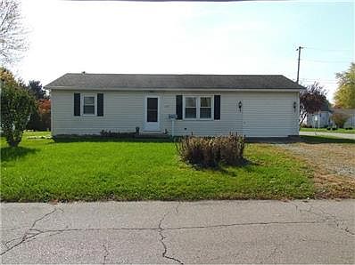 Front Exterior, home sits on 2 lots, corner position with off street parking.