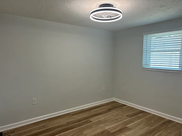 Back bedroom is bright with new lighting, ceiling fan and window opens to LARGE courtyard (of which will be hardscaped with paver around mid June).