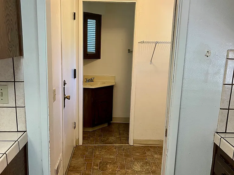 Laundry room off the kitchen, 1/2 bathroom, and door to garage.
