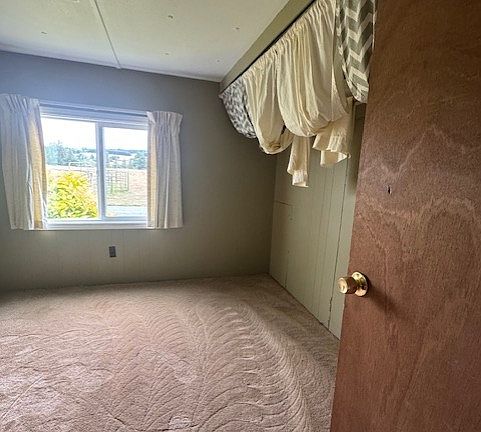 bedroom 2 the curtains are the closet doors