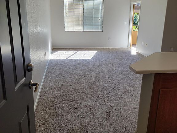Entrance to living room. New carpet and fresh paint.