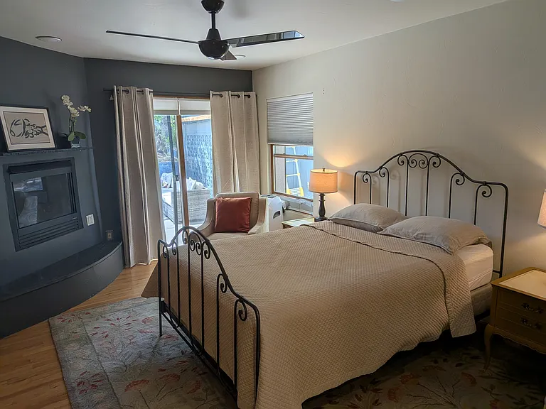 Large Master Bedroom (with heat rated gas fireplace, walk in closet, sink and sitting area)