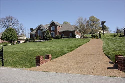 Aggregate Drive and 3 car Garage