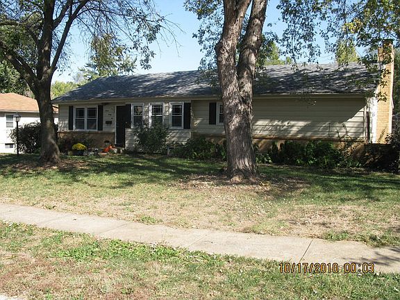 2 large trees in front yard provide shade to home