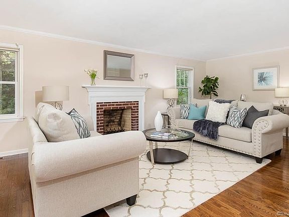 Formal living room with fireplace and beautiful hardwood floors