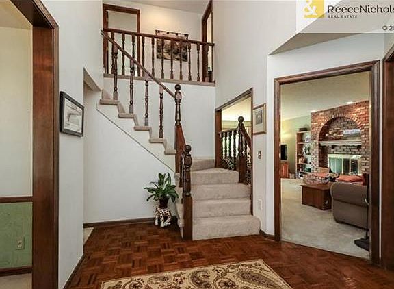 Dramatic two story foyer open to second floor.