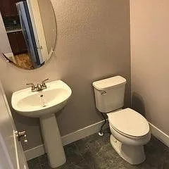 Pedestal sink in powder room.