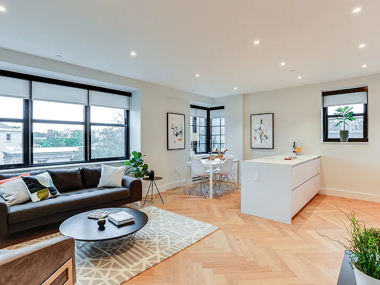 Open concept living and dining rooms with brand new hardwood flooring