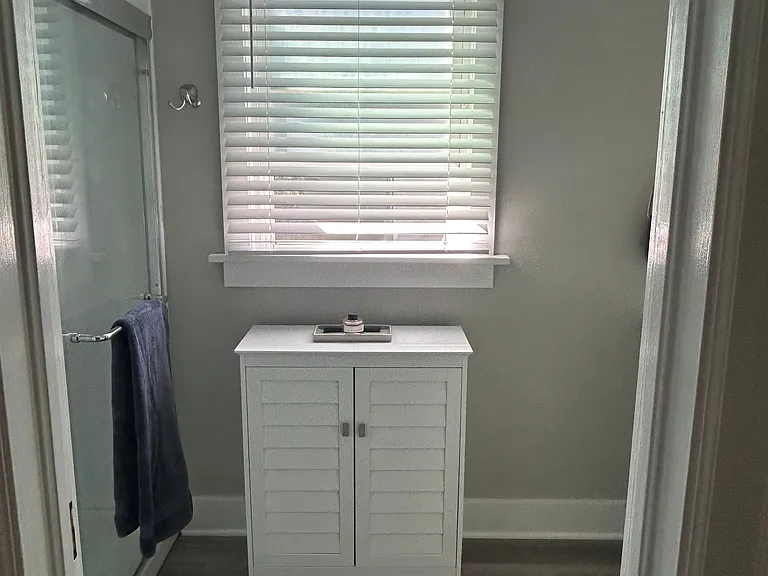 Simple floor cabinet for additional storage for towels and toiletries.