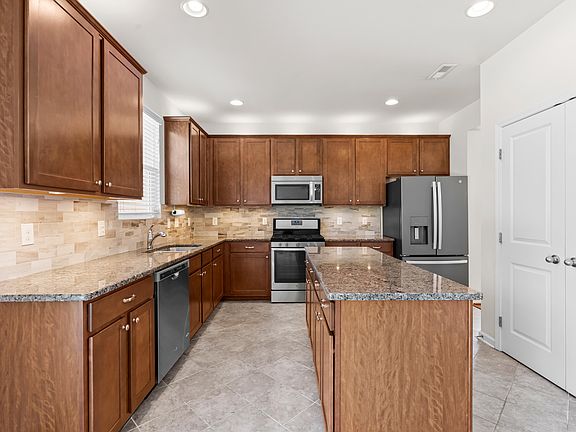 Kitchen with Gas Range, Stainless Appliances, Pantry.