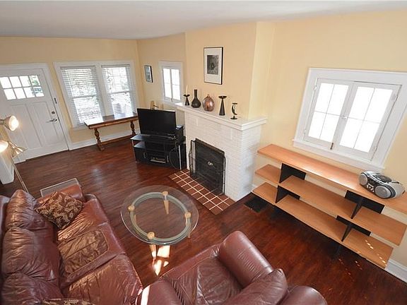 Check out all the natural light and decorative fireplace!