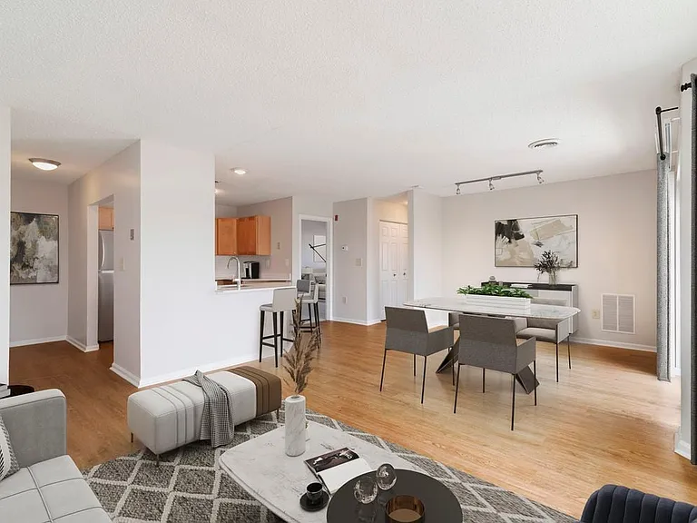 Renovated Package I living and dining room with hard surface flooring