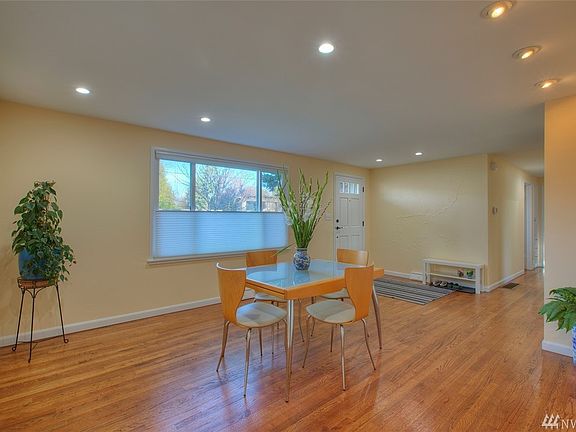 Front window and front door with hallway to bedrooms