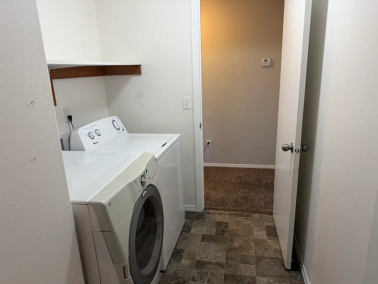 Laundry room, located off the garage entry way. Washer and dryer included in the rental.