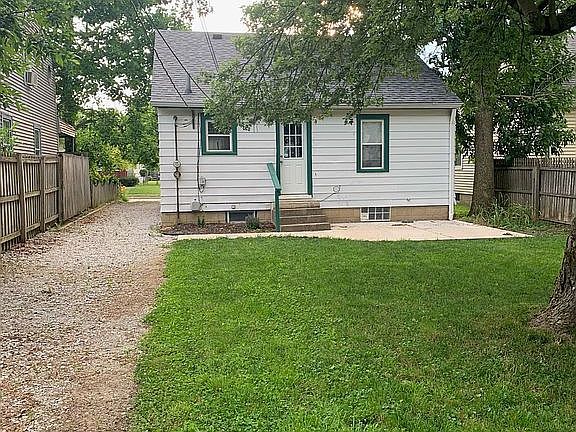 Back of house with new patio