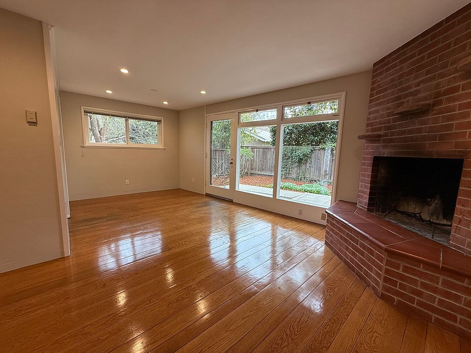 Center of living room and looking to the left into the dining area