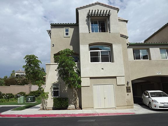 West Side View, Balcony, Lower Window of Living Room, Top window to Room 3, Window to right for Room 1, Front Yard.