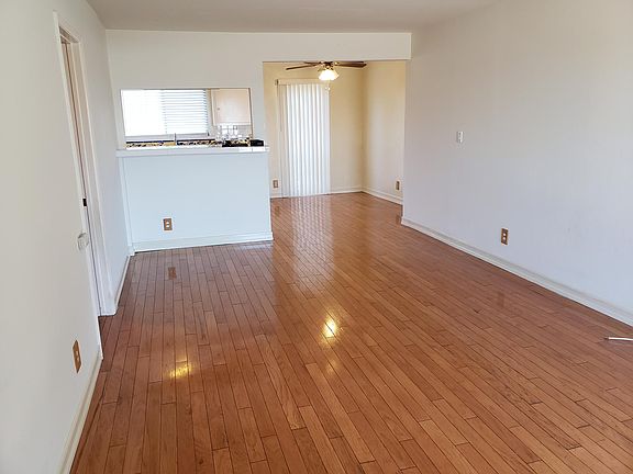 Another angle of living room looking into dining area/kitchen