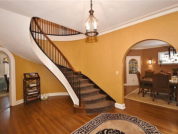 Gleaming hardwood floors and floating staircase.