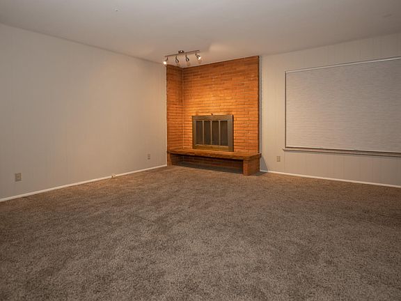 Brick and flagstone wood burning fireplace.