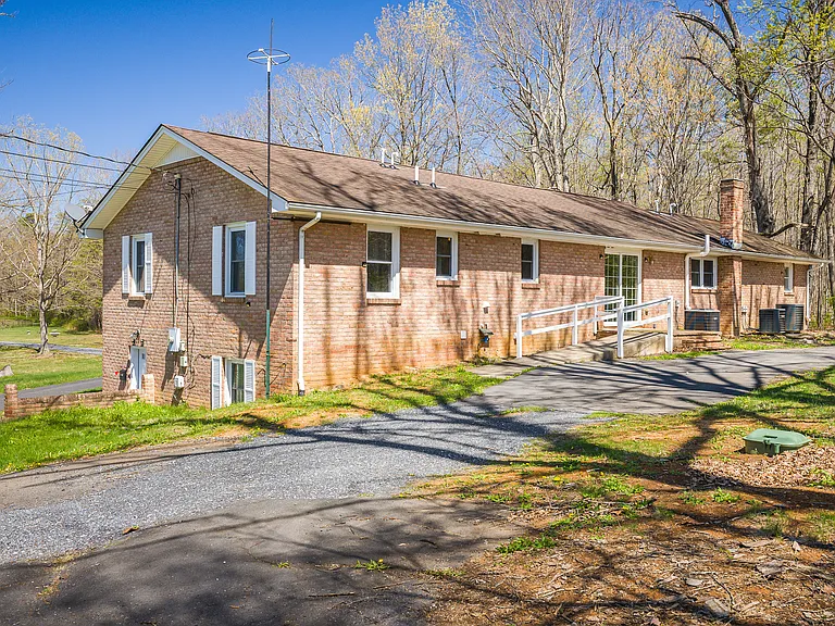 Back of house with wheelchair ramp